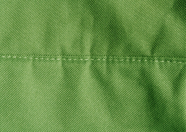 抽象派彩色织物纹理与针法。图片下载