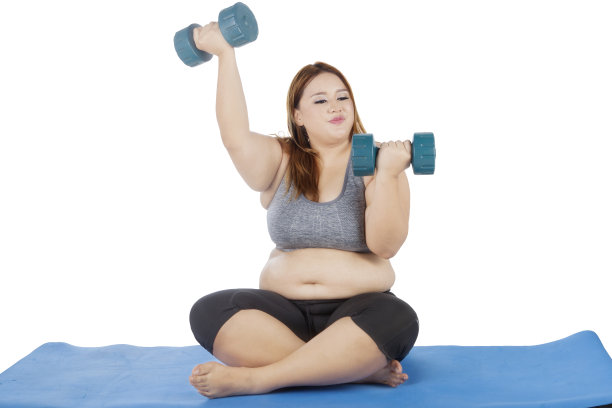 金发女人用哑铃锻炼图片下载
