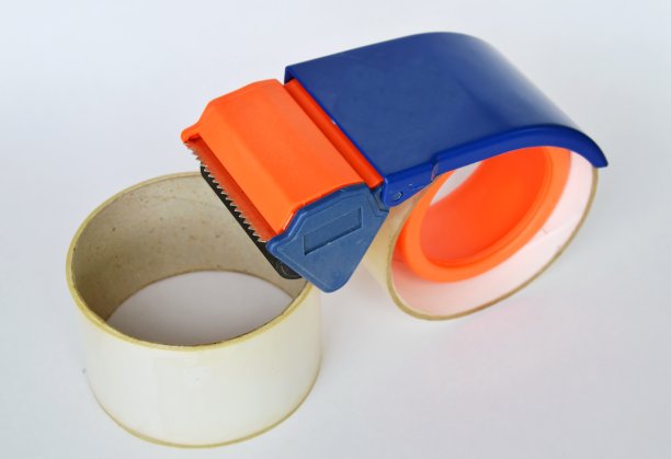胶带分散器用于白色背景的密封盒图片下载