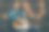 留着胡子的资深吉他手坐在椅子上弹吉他。素材图片