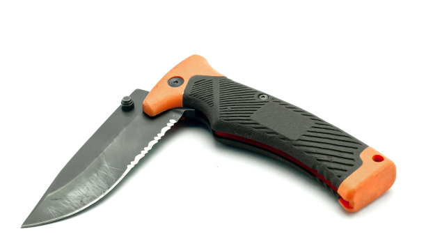 橙色折叠刀与铁握好。图片下载