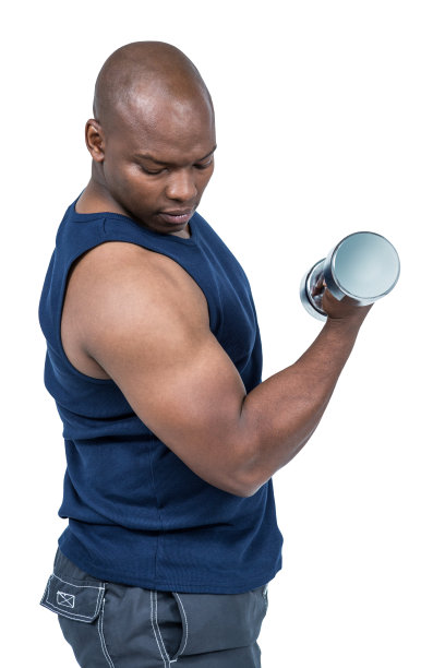 肌肉发达的人用哑铃锻炼图片下载