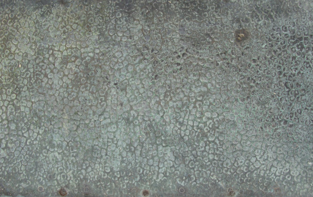 破旧的蓝绿色锤青铜面板图片下载