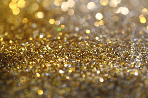 抽象的金色散景背景与闪耀的散焦火花图片下载
