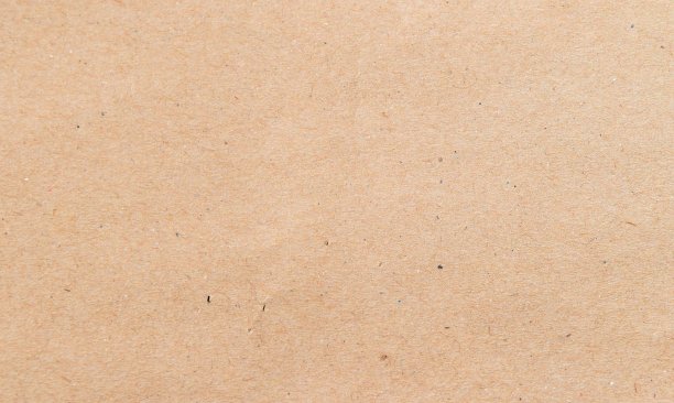 表面为空的棕黄色，有散落的小棕色斑点，是纸盒或纸板图片下载