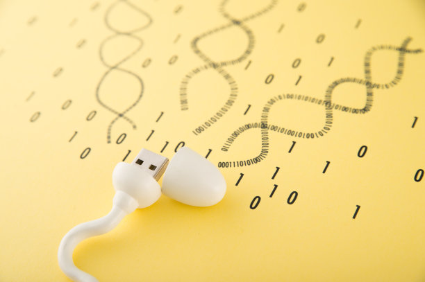 精子形状的物体，DNA背景的USB存储器图片下载