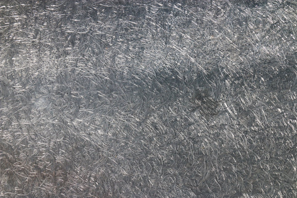 一个压缩的纤维材料纹理的特写。灰色背景。图片下载