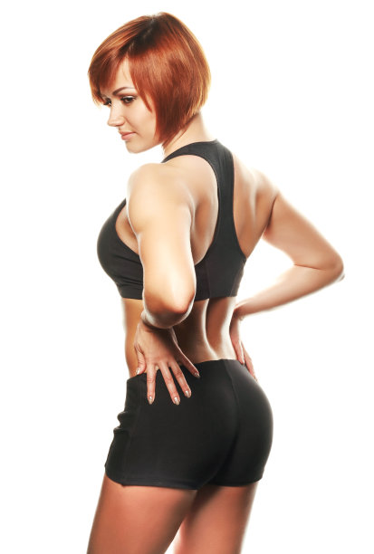 背部视图的健康女运动员对白色的背景图片下载