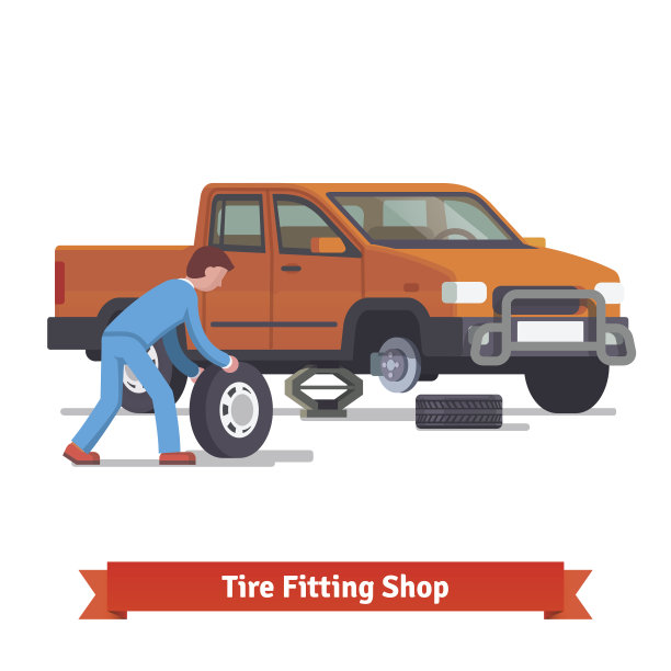 汽车机械师滚动轮胎来换轮胎图片下载