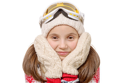 一个快乐的年轻女孩的肖像滑雪，孤立在白色素材图片
