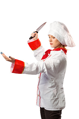 漂亮的厨师用刀切图片下载