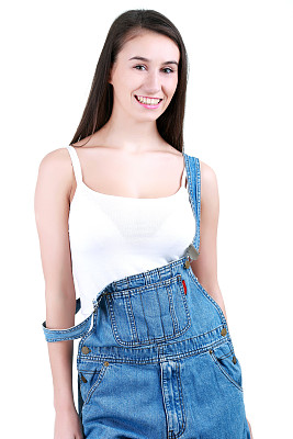 年轻女性建筑工人的肖像在白色的工作服图片下载