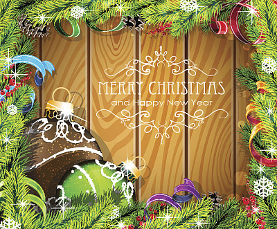 木制背景上的棕色和绿色圣诞球图片下载