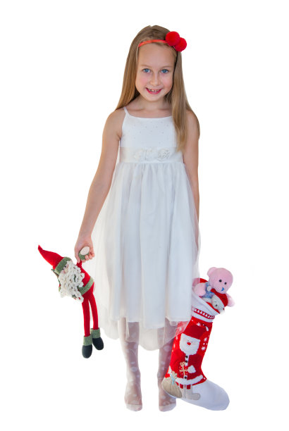 带着圣诞礼物的快乐小女孩图片下载