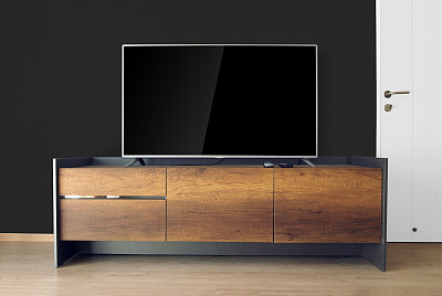 黑色墙壁的电视架上的Led电视素材图片