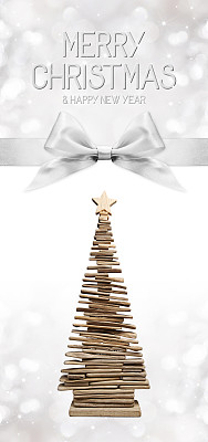 圣诞快乐，新年快乐的文字用木树和银丝带结图片下载