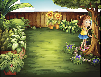 小女孩在花园里研究植物图片下载