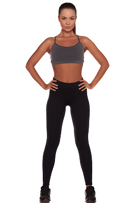 健身妇女在运动风格站在孤立的白色背景图片下载