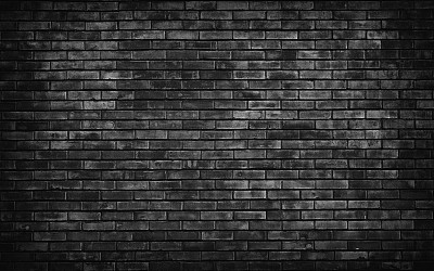旧的黑色砖墙背景。图片下载
