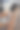 年轻女子坐在桌边用手机端着咖啡。图片下载