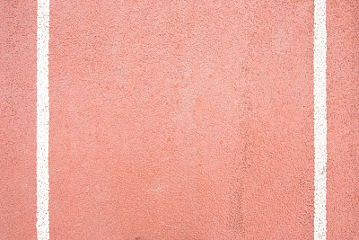 体育场顶视图上的红色跑道表面，作为拷贝空间的背景。素材图片