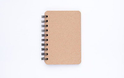 带弧角的棕色螺旋笔记本图片下载