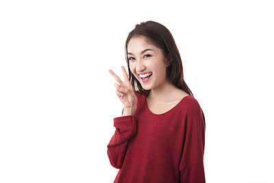 肖像美丽的亚洲女孩显示v字在白色的背景图片下载