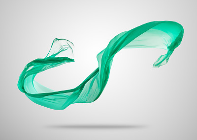 灰色背景上光滑优雅的绿色布料图片下载