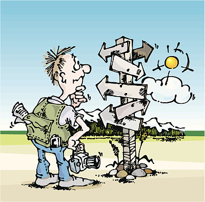 一个年轻的游客在山旁的十字路口图片下载