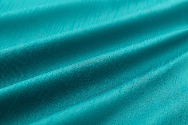 绿松石背景豪华布料或波浪褶皱的垃圾丝绸质地缎子图片下载