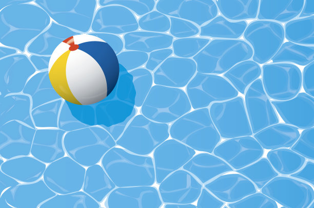 浮在蓝色游泳池里的沙滩球。夏天的背景。图片下载