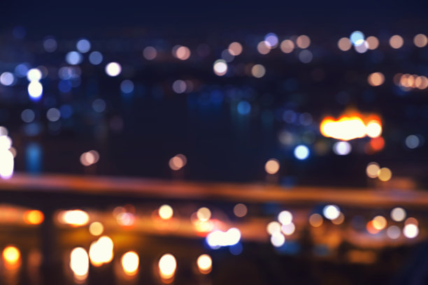 抽象的夜间灯光散景在黄色色调和黑暗图片下载