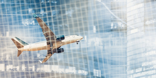 在摩天大楼上飞行的飞机和二进制密钥背景图片下载