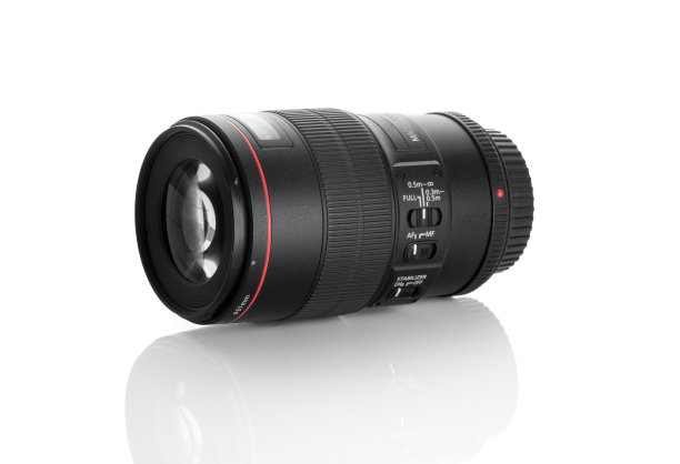 侧面的专业相机镜头上的白色图片下载