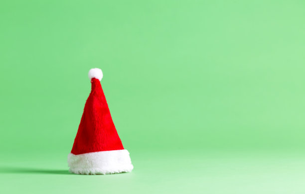 圣诞老人的帽子在明亮的背景图片下载
