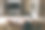 年轻女子躺在家里的沙发上，在她的客厅里放松和看电视。关闭了。后视图。与地方的文本。图片下载