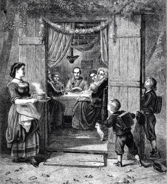 住棚节:一家人坐在茅屋里庆祝图片下载