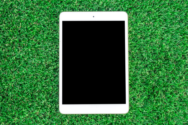 移动智能手机上的绿草背景。图片下载