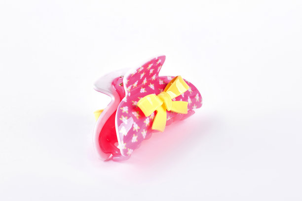 白色背景上的粉色发夹。图片下载