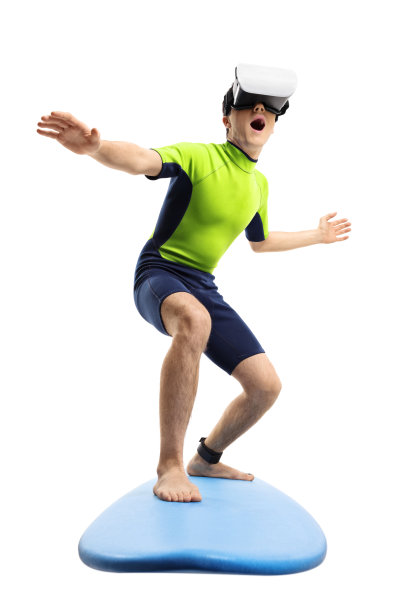 一个十几岁的男孩用冲浪板和虚拟现实头盔冲浪图片下载