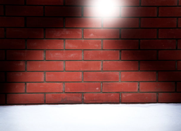 圣诞砖墙背景与圣诞老人帽子形状图片下载