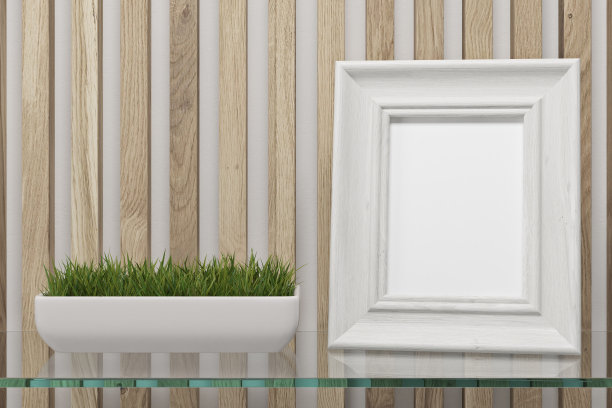 玻璃桌上放着一幅镶了框的照片图片下载