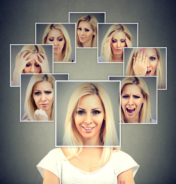 一个快乐的蒙面女人的肖像表达不同的情绪素材图片