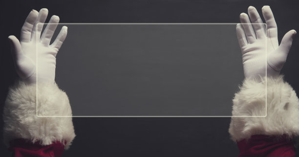 圣诞老人的手握着电子纸图片下载