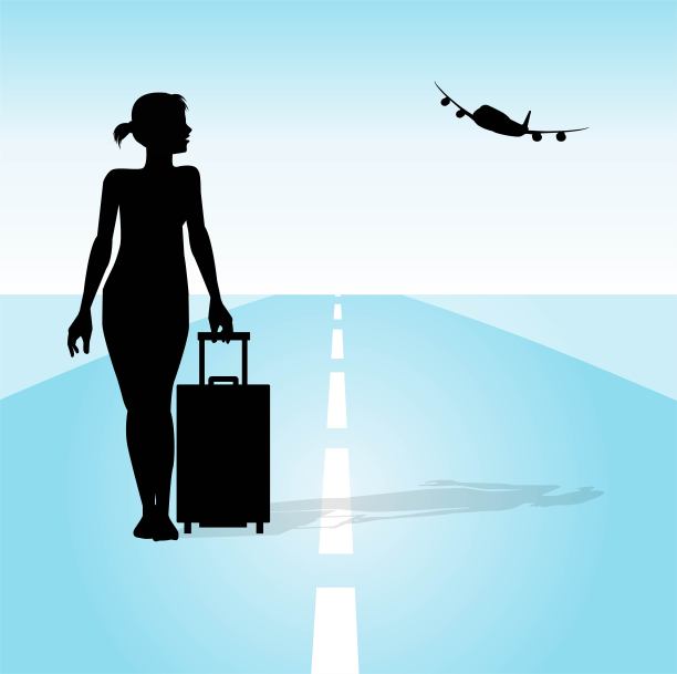 带着手提箱和飞机的年轻女子图片下载