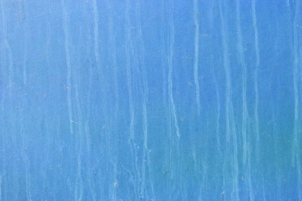 白色的线条在蓝色的表面上垂直流动图片下载