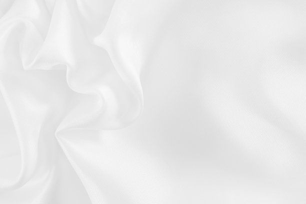 白色织物质地为背景和设计，丝绸或亚麻的美丽图案。素材图片