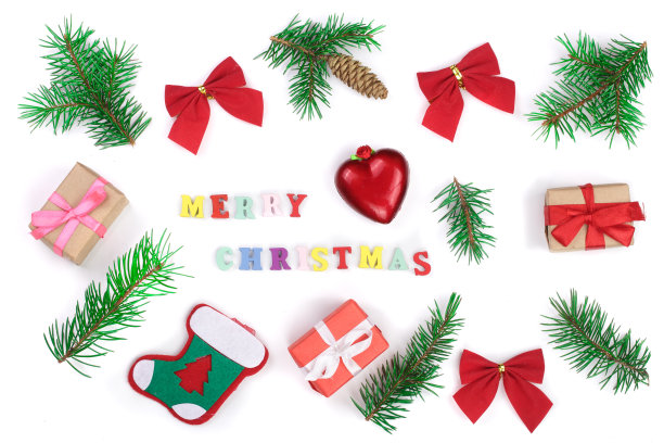 圣诞节背景，白色背景上用冷杉树枝装饰的圣诞快乐铭文图片下载