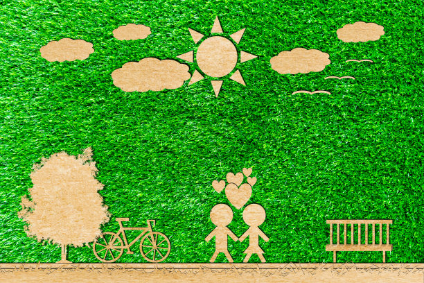 男人和女人喜欢剪纸自行车太阳树云在一个绿色的背景图片下载