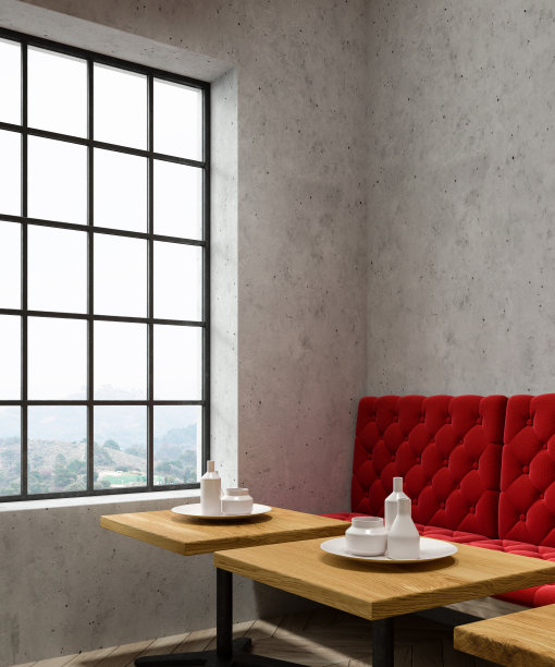 混凝土咖啡馆角落，红色沙发图片下载